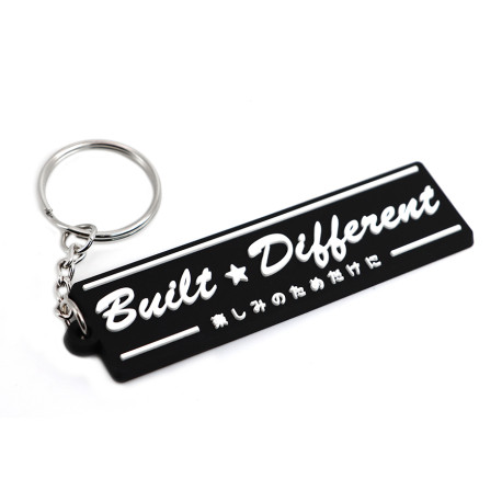Brelocuri Breloc din cauciuc PVC "Built Different" | race-shop.ro